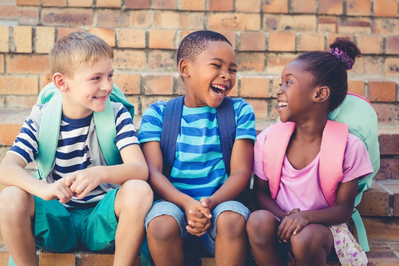  A group of students sitting in a circle, engaged in a morning meeting.